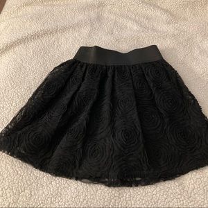 Black mini skirt with floral pattern